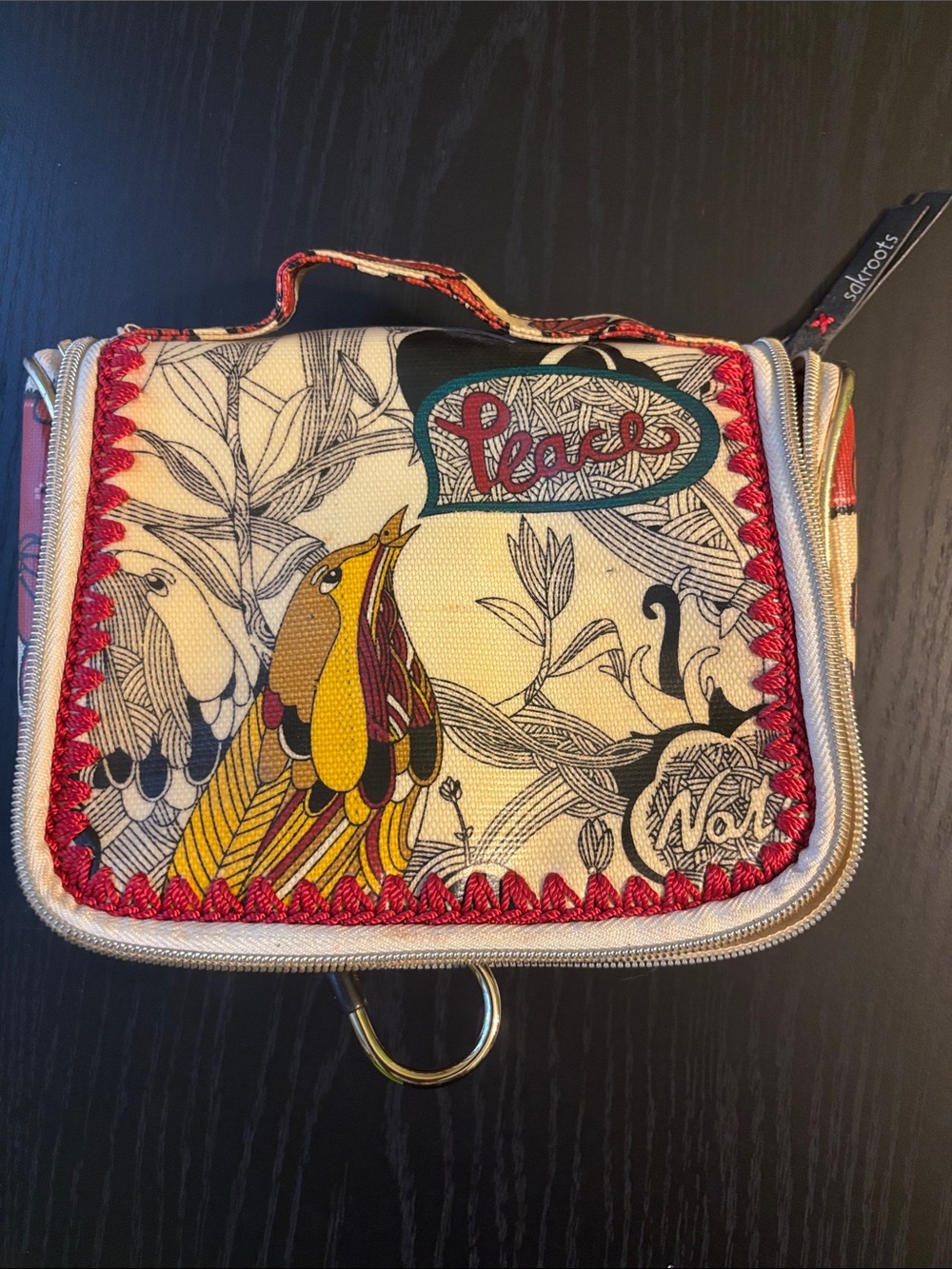 Sakroots Cream Canvas Cosmetic Pouch with Red Trim and Colorful Bird Art